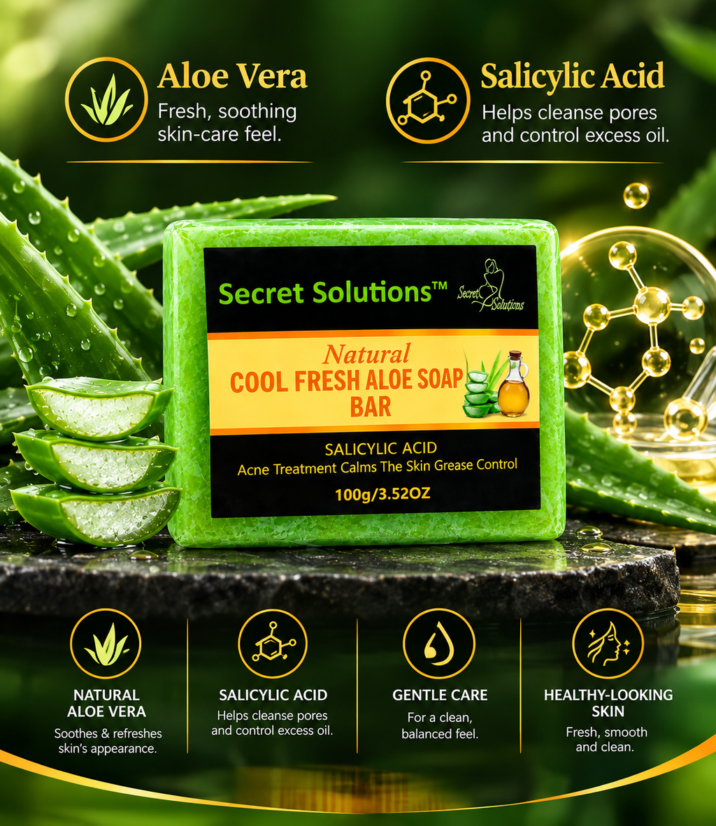 A green rectangular bar of Secret Solutions Natural Cool Fresh Aloe Soap Bar is centered on a dark stone surface, surrounded by aloe vera leaves and gel slices. The product has a black label with green and orange text.
